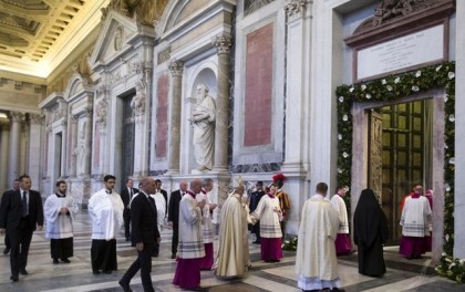 Pope Francis, center, arrives to lead the second Vespers prayer in St. Paul Outside the Walls Basilica on the occasion of the liturgical Feast of the Conversion of St. Paul the Apostle, in Rome, Monday, Jan. 25, 2016. (Claudio Peri/Pool Photo via AP)