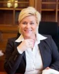 Finansminister Siv Jenssen har grunn til å smile: Hun har et helt statsbudsjett i "valutareserve"! (Foto: Regjeringen)