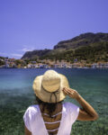 Young woman at shore of Megisti (Kastellorizo) Island, Greece.