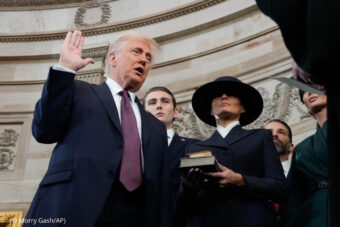 Donald Trump is sworn in as the 47th president of the United States by Chief Justice John Roberts as Melania Trump holds the Bible during the 60th Presidential Inauguration in the Rotunda of the U.S. Capitol in Washington, Monday, Jan. 20, 2025. (AP Photo/Morry Gash, Pool)