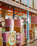 Futuristic Technology Retail Warehouse: Worker Starts Inventory Digitalization with Barcode Scanner Analyzes Goods, Cardboard Boxes, Products. Delivery Infographics in Logistics, Distribution Center