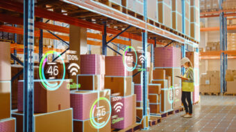 Futuristic Technology Retail Warehouse: Worker Starts Inventory Digitalization with Barcode Scanner Analyzes Goods, Cardboard Boxes, Products. Delivery Infographics in Logistics, Distribution Center